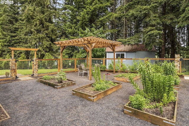 view of yard featuring a garden, a pergola, and fence