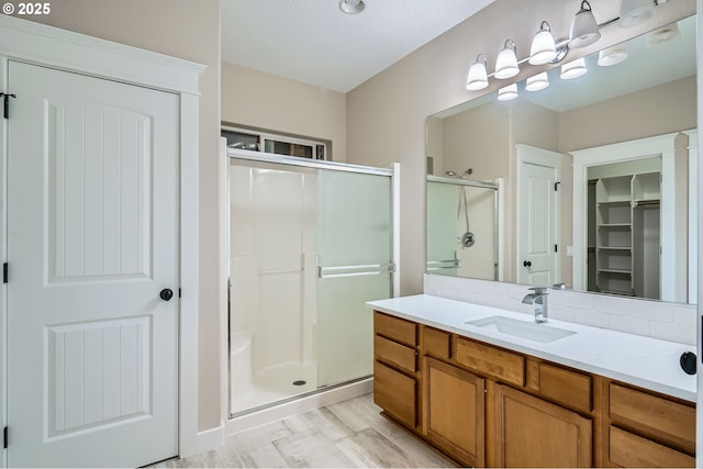 1080 Sage St, Silverton, OR 97381 - bathroom featuring a shower stall, vanity, and a spacious closet