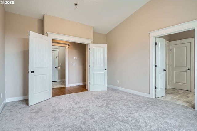 1080 Sage St, Silverton, OR 97381 - unfurnished bedroom featuring carpet floors and vaulted ceiling