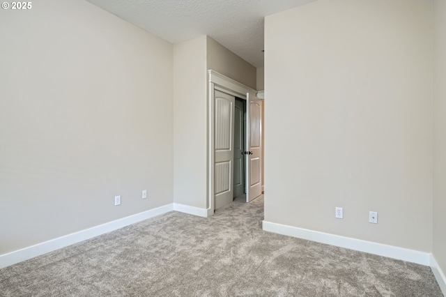 1080 Sage St, Silverton, OR 97381 - carpeted empty room featuring baseboards and a textured ceiling