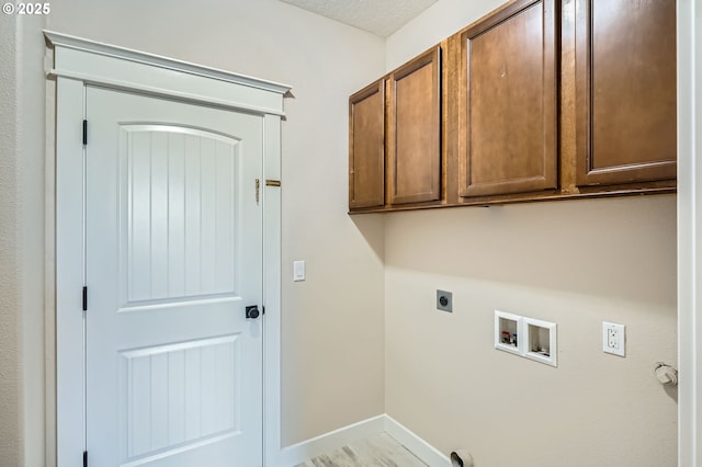 1080 Sage St, Silverton, OR 97381 - laundry room featuring electric dryer hookup, cabinet space, and washer hookup