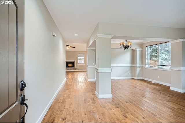 1080 Sage St, Silverton, OR 97381 - entrance foyer featuring a lit fireplace, light wood-style flooring, a chandelier, recessed lighting, and ceiling fan