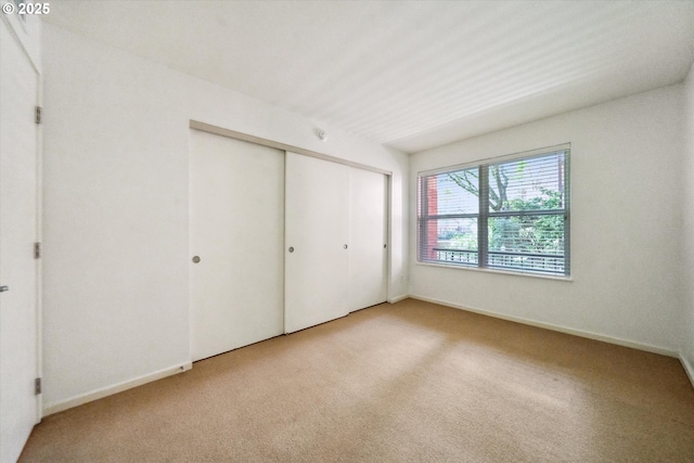 1500 SW Park Ave, Portland, OR 97201 - unfurnished bedroom with carpet flooring, baseboards, and a closet