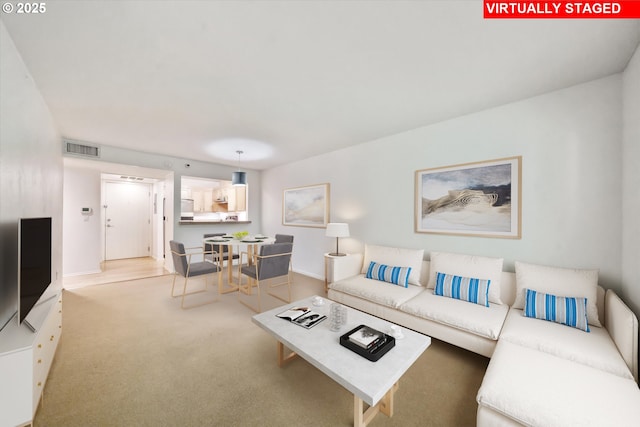 1500 SW Park Ave, Portland, OR 97201 - living room featuring baseboards, visible vents, and carpet