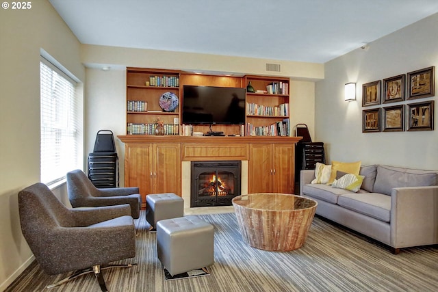 1500 SW Park Ave, Portland, OR 97201 - carpeted living area with a glass covered fireplace and visible vents