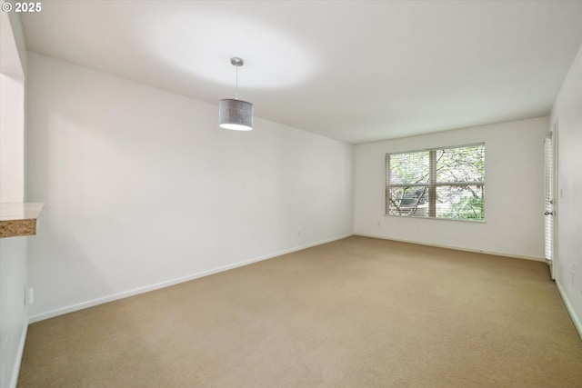 1500 SW Park Ave, Portland, OR 97201 - spare room with baseboards and light carpet