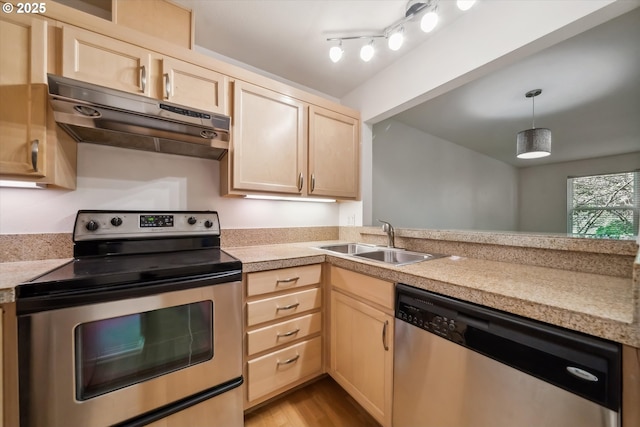 1500 SW Park Ave, Portland, OR 97201 - kitchen featuring a sink, light brown cabinets, stainless steel appliances, and under cabinet range hood