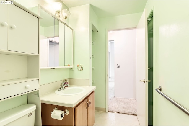 bathroom featuring toilet and vanity