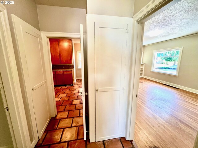 735 SE Spokane St, Portland, OR 97202 - hall with baseboards and a textured ceiling