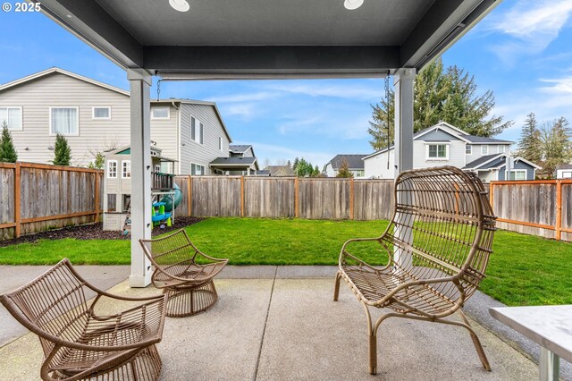 view of yard with a playground and a patio