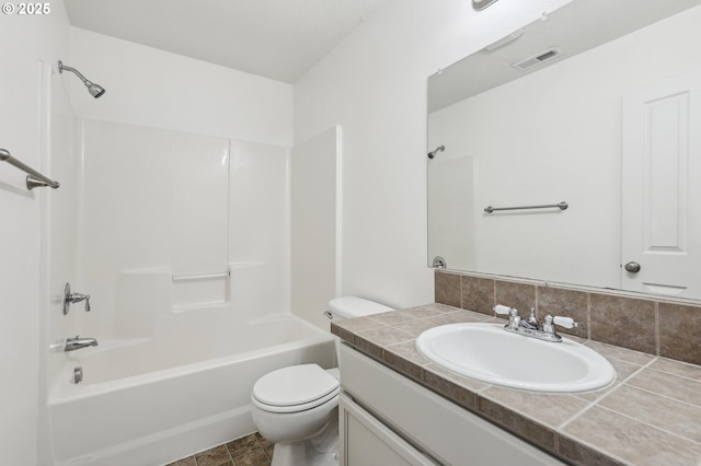 full bathroom with vanity, toilet, tasteful backsplash, and shower / tub combination