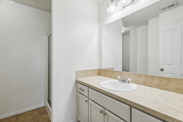 bathroom featuring vanity and walk in shower