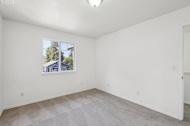 empty room with light colored carpet