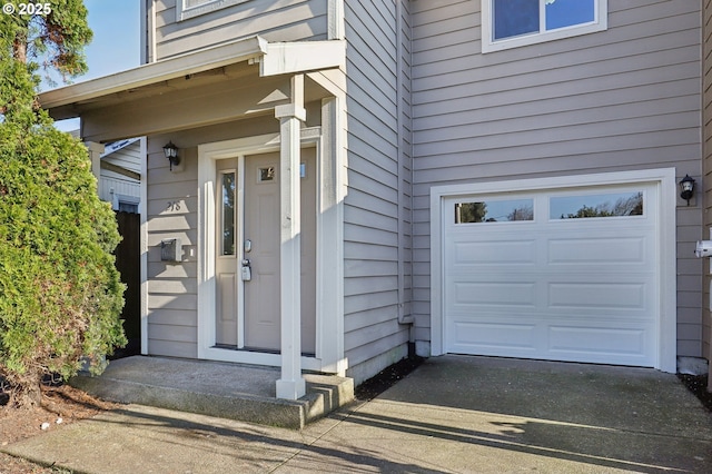 doorway to property with a garage