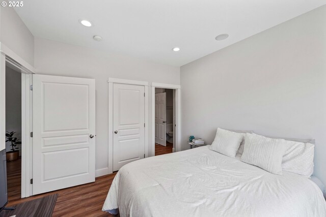 bedroom with wood finished floors and recessed lighting