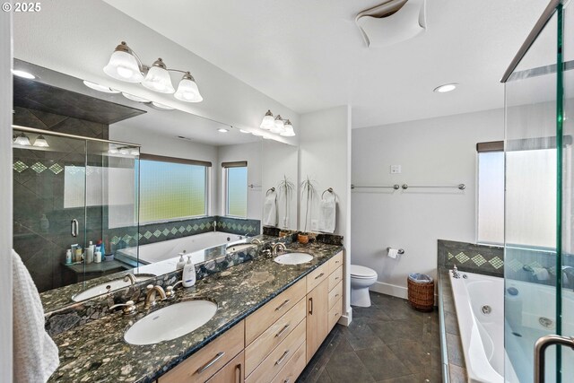 bathroom with a shower stall, a jetted tub, double vanity, toilet, and recessed lighting