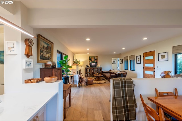 dining area featuring light wood-style flooring and recessed lighting