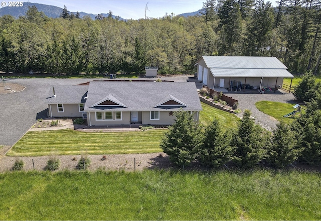 bird's eye view with a mountain view and a wooded view