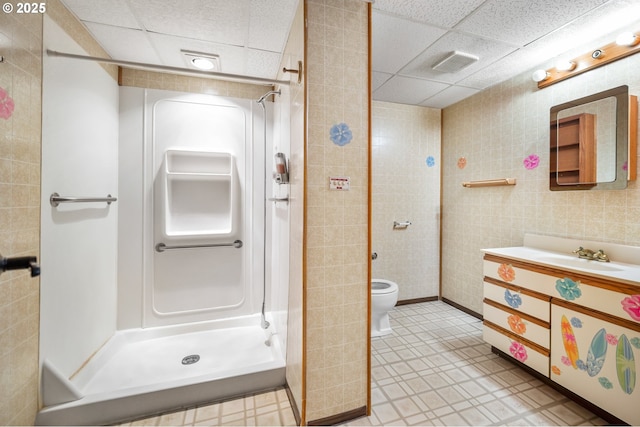 1339 SW 27th Ct, Gresham, OR 97080 - bathroom featuring a drop ceiling, a stall shower, vanity, and toilet