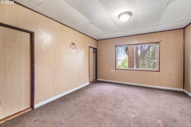 1339 SW 27th Ct, Gresham, OR 97080 - carpeted spare room featuring wooden walls, a paneled ceiling, and baseboards