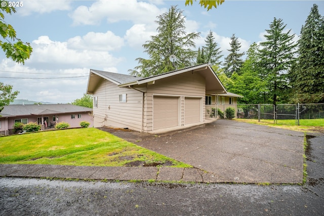 1339 SW 27th Ct, Gresham, OR 97080 - view of side of home featuring a detached garage and a gate