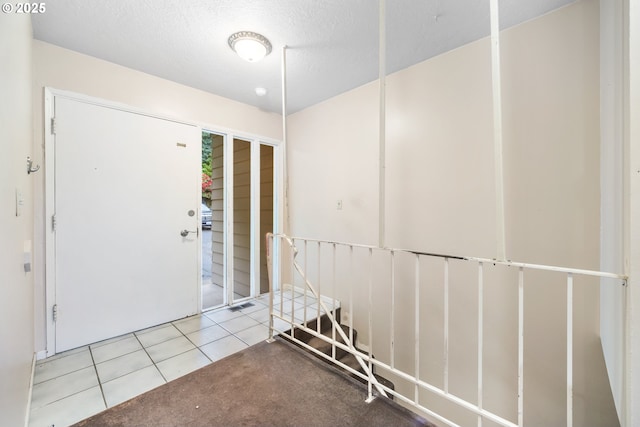 1339 SW 27th Ct, Gresham, OR 97080 - foyer featuring tile patterned floors and a textured ceiling