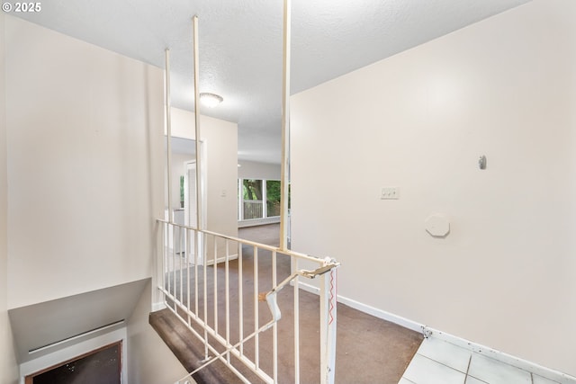 1339 SW 27th Ct, Gresham, OR 97080 - corridor featuring an upstairs landing, baseboards, and a textured ceiling
