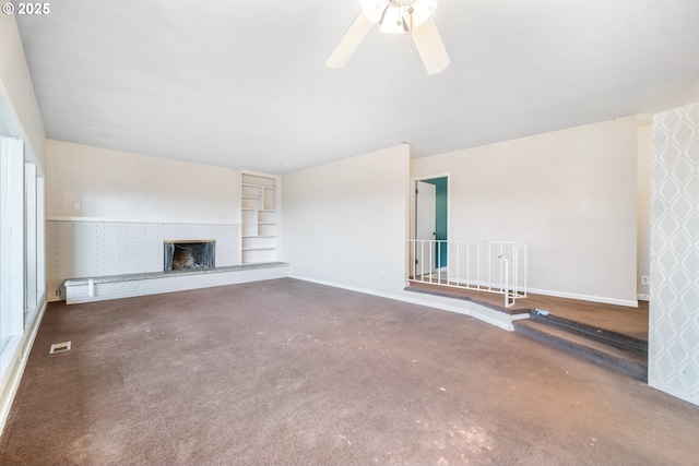 1339 SW 27th Ct, Gresham, OR 97080 - unfurnished living room featuring baseboards, a brick fireplace, carpet, and a ceiling fan
