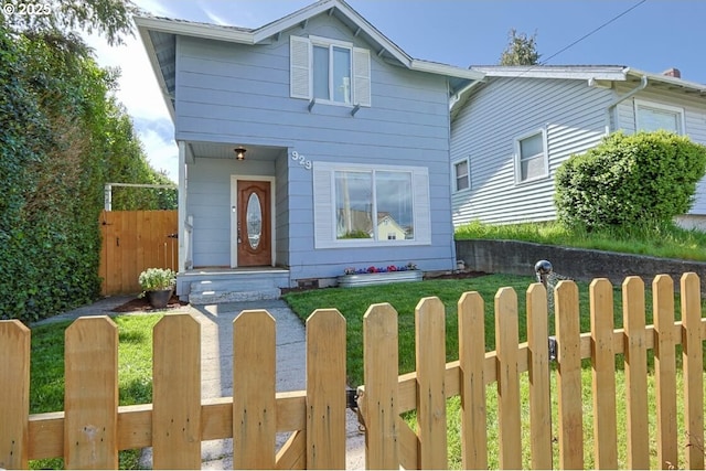 929 S 7th St, Coos Bay, OR 97420 - traditional-style house with a fenced front yard and a gate