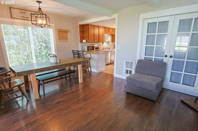 929 S 7th St, Coos Bay, OR 97420 - dining room with dark wood-style floors, beamed ceiling, french doors, and heating unit