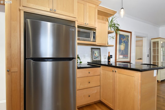 1330 SE 14th Ave SE, Portland, OR 97214 - kitchen featuring stainless steel appliances, light brown cabinets, a peninsula, dark countertops, and ornamental molding