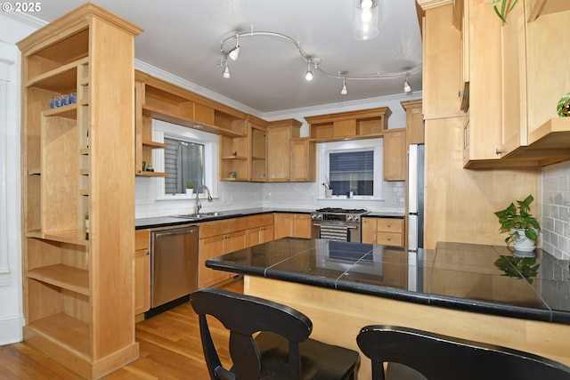 1330 SE 14th Ave SE, Portland, OR 97214 - kitchen featuring open shelves, appliances with stainless steel finishes, a peninsula, light wood-type flooring, and a breakfast bar area