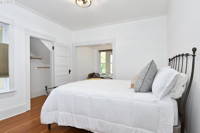 1330 SE 14th Ave SE, Portland, OR 97214 - bedroom featuring wood finished floors, ornamental molding, and a closet