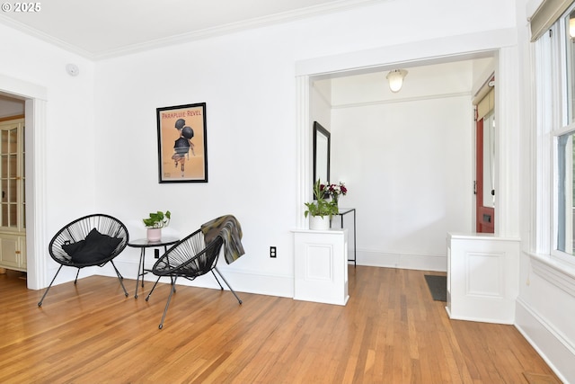 1330 SE 14th Ave SE, Portland, OR 97214 - living area with light wood-type flooring, crown molding, and baseboards