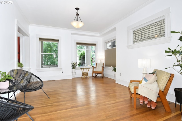 1330 SE 14th Ave SE, Portland, OR 97214 - sitting room with light wood-style flooring, crown molding, and baseboards