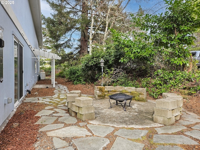 view of patio / terrace with a fire pit