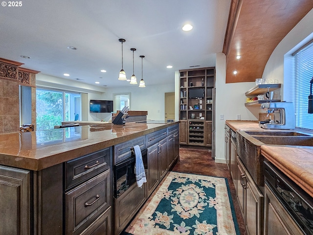 kitchen with open shelves, decorative light fixtures, recessed lighting, wine cooler, and black electric cooktop