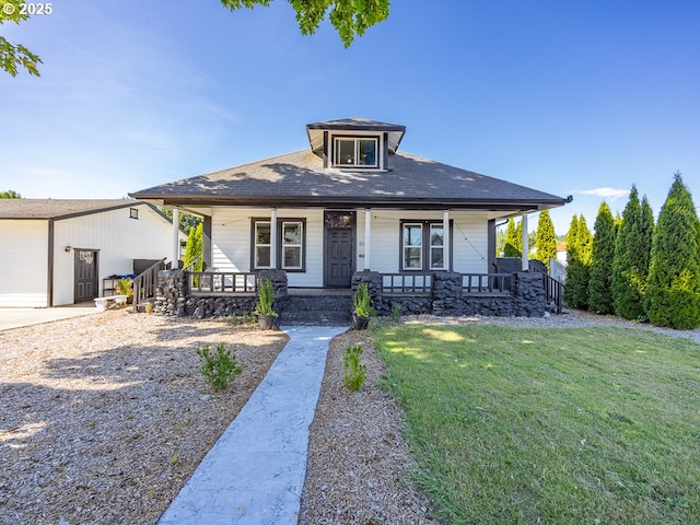 410 E Yacolt Rd, Yacolt, WA 98675 - bungalow featuring a porch, a front lawn, roof with shingles, and an outbuilding