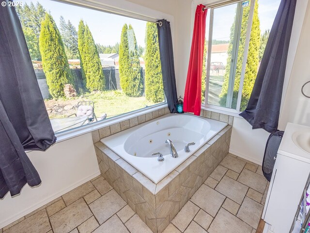 410 E Yacolt Rd, Yacolt, WA 98675 - full bathroom featuring a whirlpool tub, stone tile floors, and plenty of natural light