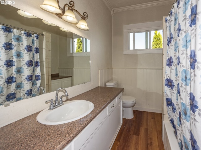 410 E Yacolt Rd, Yacolt, WA 98675 - full bathroom with vanity, crown molding, wood finished floors, a wainscoted wall, and shower / bathtub combination with curtain