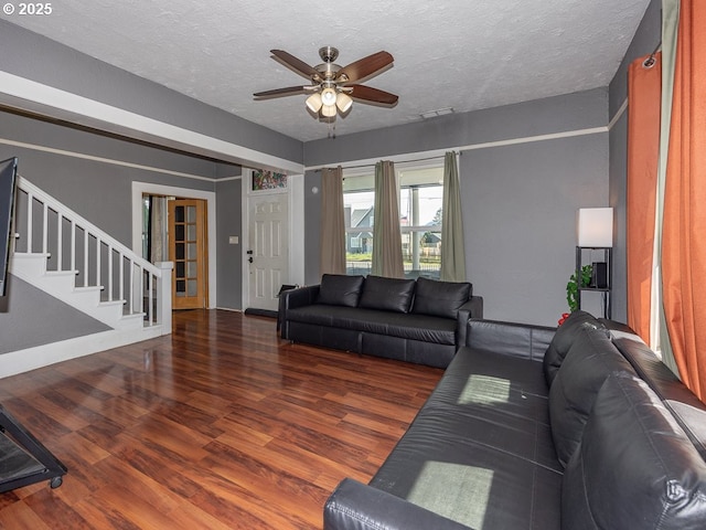 410 E Yacolt Rd, Yacolt, WA 98675 - living room with wood finished floors, ceiling fan, stairway, and a textured ceiling