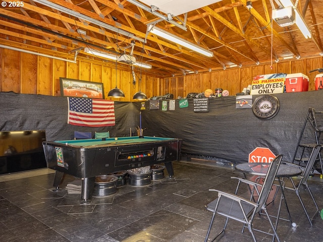 410 E Yacolt Rd, Yacolt, WA 98675 - garage featuring a garage door opener and wood walls