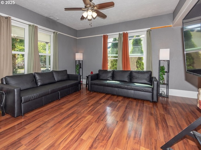 410 E Yacolt Rd, Yacolt, WA 98675 - living area featuring ceiling fan, wood finished floors, healthy amount of natural light, and a textured ceiling