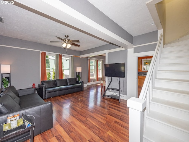 410 E Yacolt Rd, Yacolt, WA 98675 - living room featuring wood finished floors, stairway, ceiling fan, healthy amount of natural light, and a textured ceiling