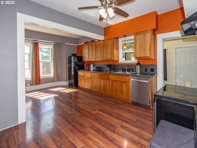 410 E Yacolt Rd, Yacolt, WA 98675 - kitchen with black appliances, ceiling fan, dark wood-style floors, and healthy amount of natural light