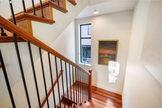 staircase featuring hardwood / wood-style floors