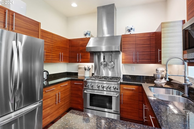 kitchen featuring dark stone countertops, sink, stainless steel appliances, and exhaust hood