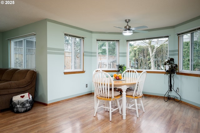 sunroom featuring ceiling fan