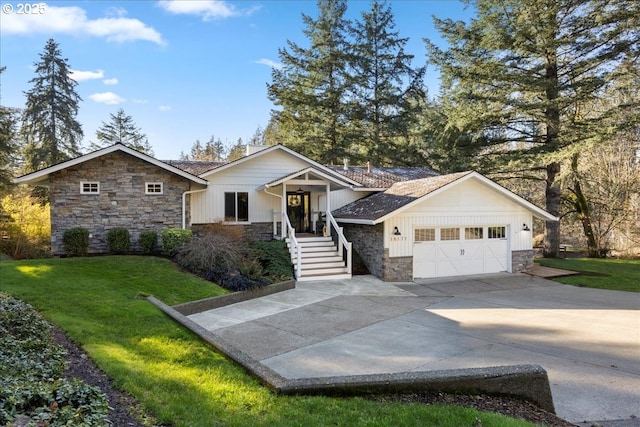 view of front of house with a garage and a front yard