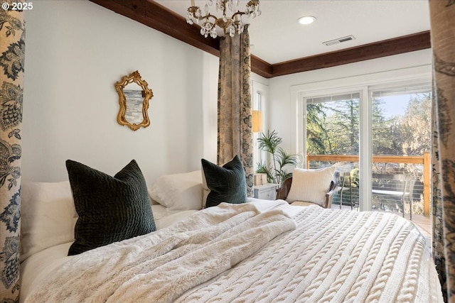 bedroom featuring a chandelier